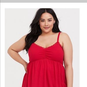 Torrid woman red sleeveless blouse.